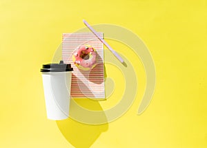 White paper cup and donut