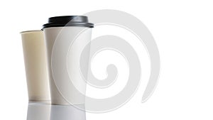 White paper cup for hot coffee with black lid isolated on white background. Takeaway blank small tea cup for your design