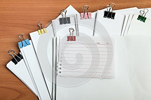 White paper document with reminder note