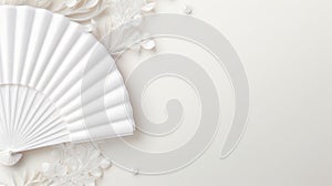 A white paper fan with a floral design on a white background. This image shows a white paper fan with a delicate floral