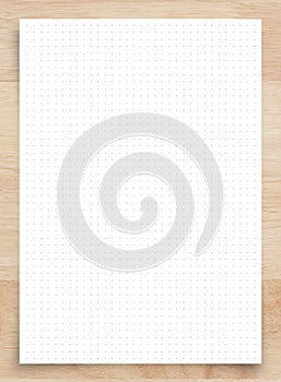 White paper with grid line pattern on wood, use for background