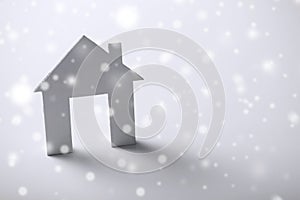 White paper house over white background