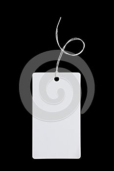 White paper label, price tag for clothing made of thick cardboard, isolate for clipping on a black background