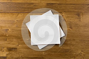 White paper napkin on wooden background