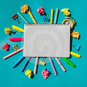 White paper notebook Empty frame border of school stationery supplies with alarm clock. Copy space for your text or