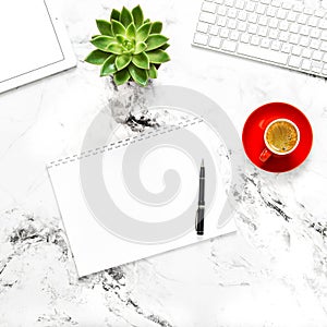 White paper notebook tablet pc working desk Flat lay