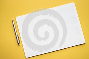 White paper notepad on pastel color backgrounds.Flat lay design.