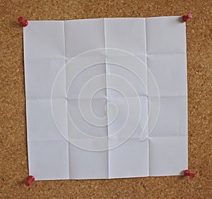 White paper on a peg board