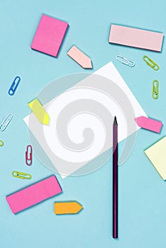 White paper pencil paperclips and reminder color papers