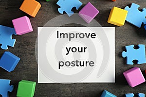 White paper with phrase IMPROVE YOUR POSTURE