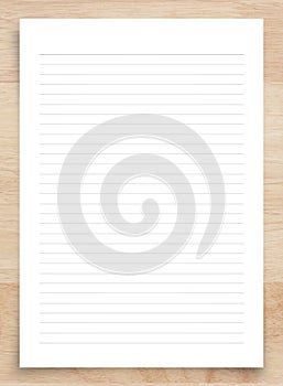 White paper sheet isolated on wood background with clipping path