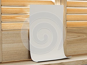 White paper sheet near window with shutters. 3d rendering