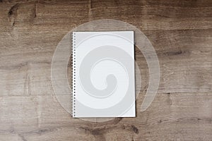 White paper and space for text on wooden background