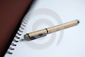 White paper spiral notebook and eco friendly pen