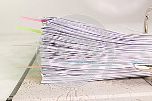 White paper stack in folder file for a business contract, income, expenses