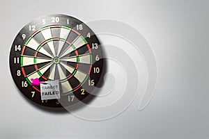 White paper with target failed text in the darts