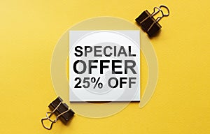 White paper with text Special Offer 25 Percent Off on a yellow background with stationery