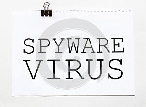 White paper with text Spyware virus on a white background with stationery