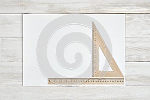 White paper with triangle and simple centimeter ruler.