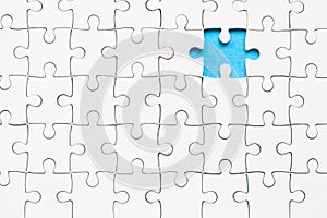 White part of jigsaw puzzle pieces on blue background. concepts of problem solving, business success, teamwork, Team playing