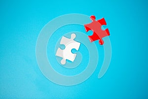 White part of jigsaw puzzle pieces on blue background. concepts of problem solving, business success, teamwork, Team playing