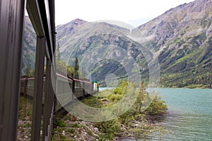 White Pass and Yukon Route railway train along Bennett Lake