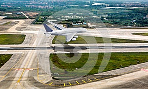 White passenger double decker plane in flight. The plane takes off from the airport runway. Airplane aerial and side view