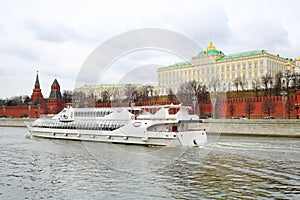 White passenger ship sails on river near Grand photo