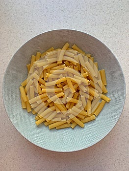 White pasta plate, grano duro pasta, long thin tubes, Italian pasta photo