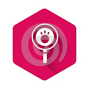 White Paw search icon isolated with long shadow. Magnifying glass with animal footprints. Pink hexagon button. Vector