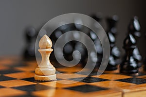 White pawn, in front of black, on a chessboard. Selective focus. Correct move. Strategy. Sport. Business.