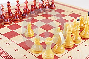 White pawn starts game of chess close up