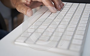 White pc keyboard ina table