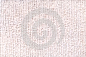 White pearl fluffy background of soft, fleecy cloth. Texture of textile closeup.