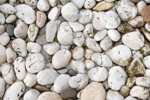 White pebble stone background. Texture and material theme