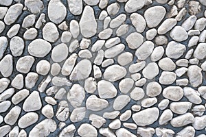 White pebble stone cemented floor, texture background photo