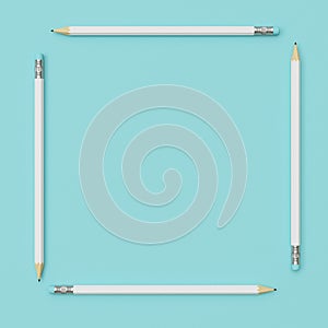 White Pencils around square shape on blue pastel paper background