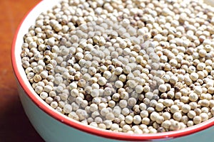 White pepper seeds in bowl.