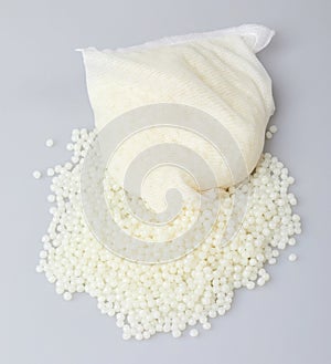 White PET granules, polymer resin, plastic granulate for injection molding process.