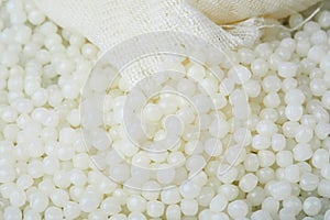 White PET granules, polymer resin, plastic granulate for injection molding process.