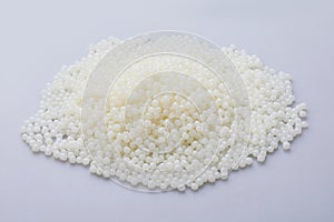 White PET granules, polymer resin, plastic granulate for injection molding process.