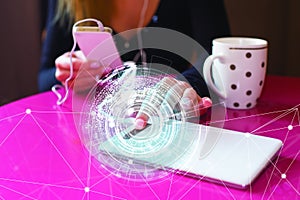 White phone on a pink table and a mug