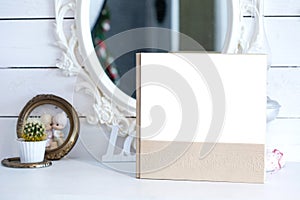 White photo book with leather and wood cover. stylish wedding photo album. Family photoalbum on the table.