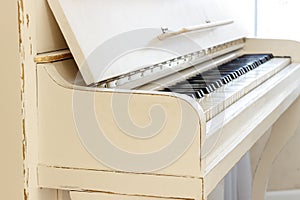 White piano, side view of instrument, musical instrument. learn