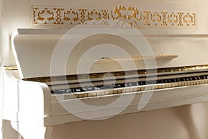 White piano, side view of instrument, musical instrument. learn