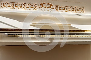 White piano, side view of instrument, musical instrument. learn photo