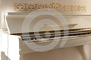 White piano, side view of instrument, musical instrument. learn photo