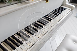 White piano in a white interior. Luxury interior.