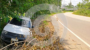 White pickup truck accident on street, countryside on bad