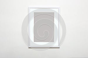 white picture frame. Stylish photoframe with passe-partout for poster or picture photo